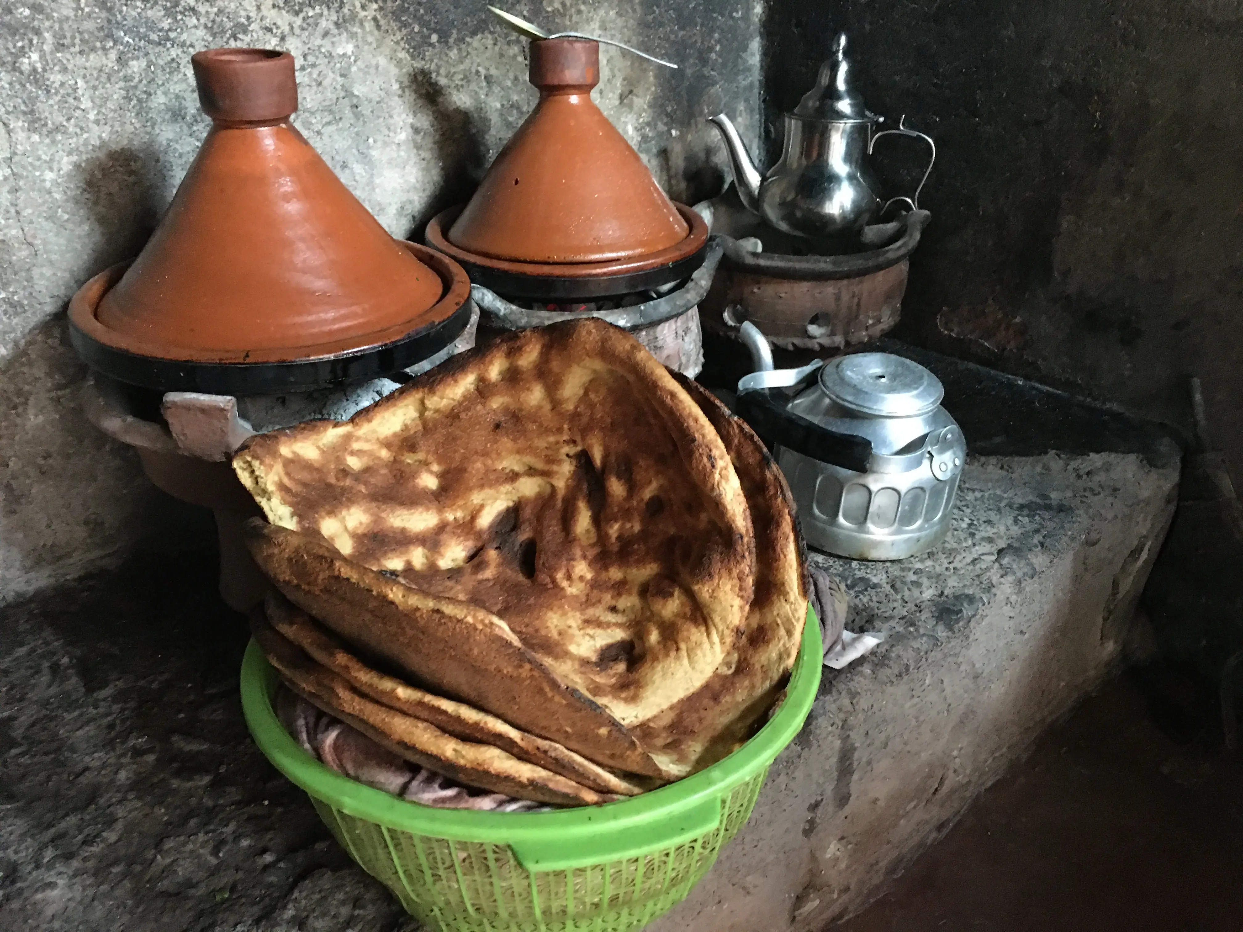 Traditional Moroccan Kitchen with Tagine Pots and Fresh Flatbread