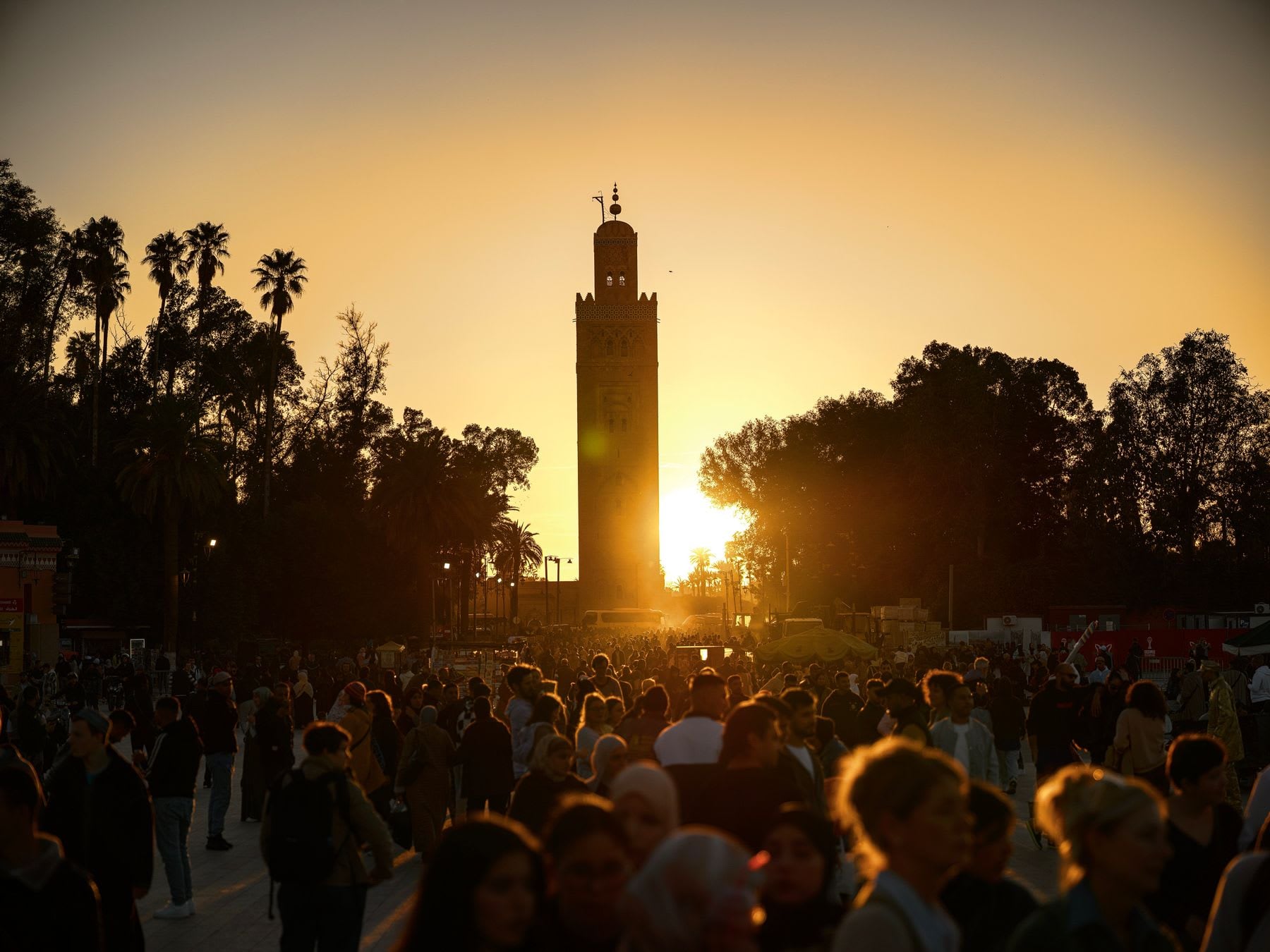 Koutoubia Mosque at sunset above the evening crowds of Marrakech